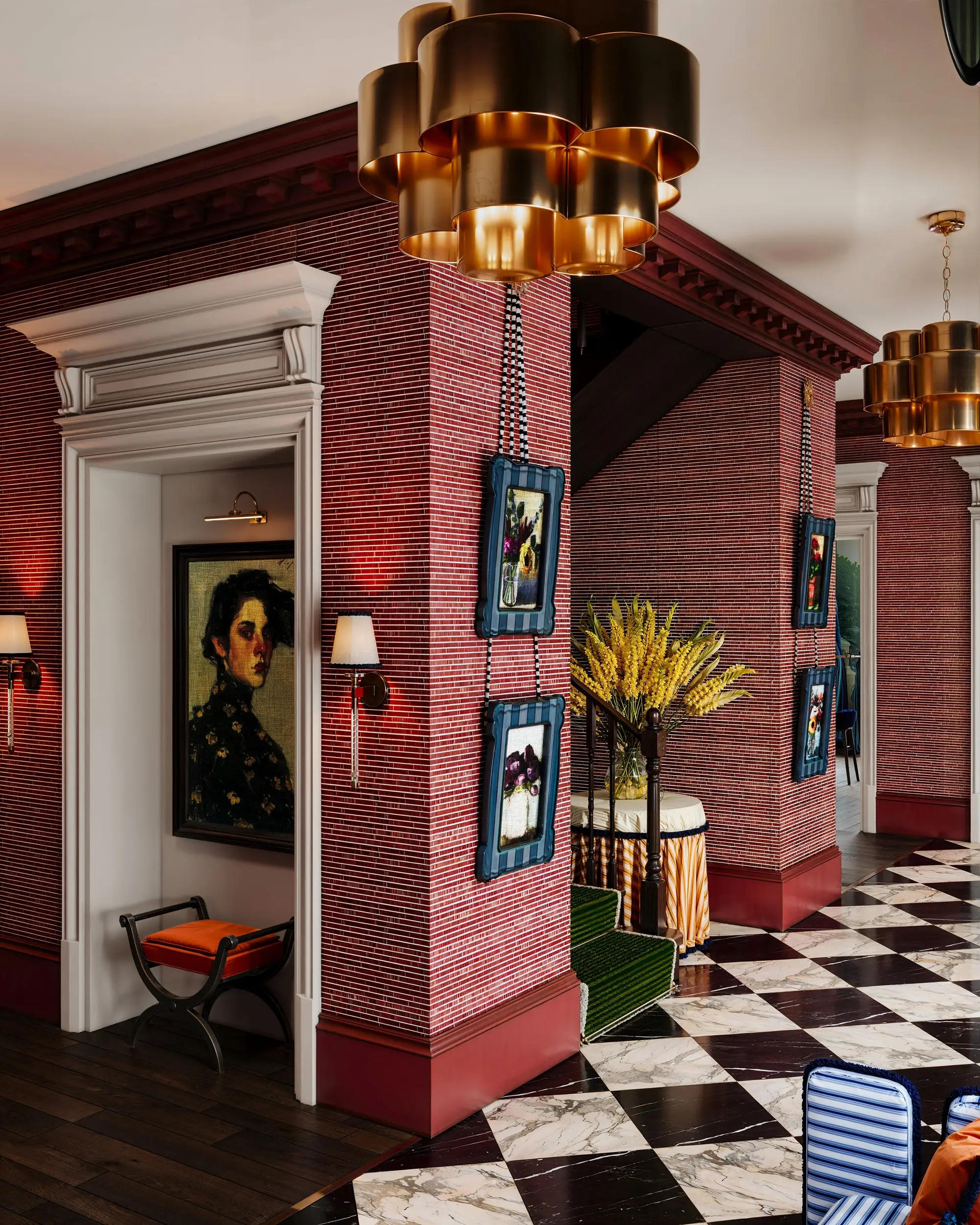 Red brick hall with brass pendants